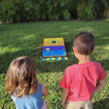 Stellar-Way-Bean-Bag-Toss-Game-Children-Playing-with-Product